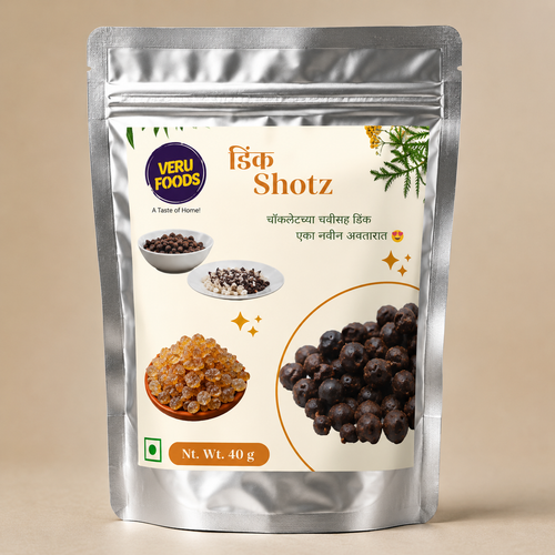 Silver foil stand-up pouch of Dink Shotz featuring chocolate-coated edible tree sap bites made with desi ghee