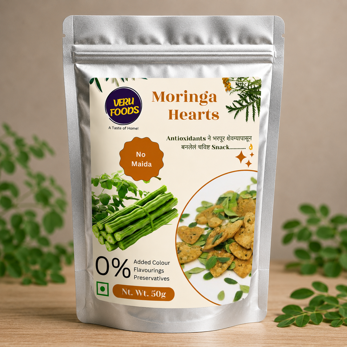 Silver foil stand-up pouch of Veru Foods Moringa Hearts, healthy whole grain snack made without maida, baked not fried, with moringa leaf imagery and clean natural packaging design.