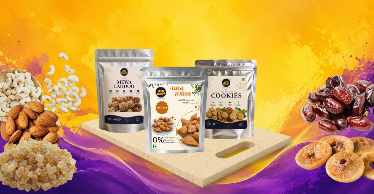 Homepage banner showing three Veru Foods products in silver stand-up pouches (Mewa Laddoo, Navratna Samosa, and Cookies) placed on a wooden board against a vibrant yellow and purple background, surrounded by almonds, cashews, dates, and dried figs, with a “View Products” button on the left.